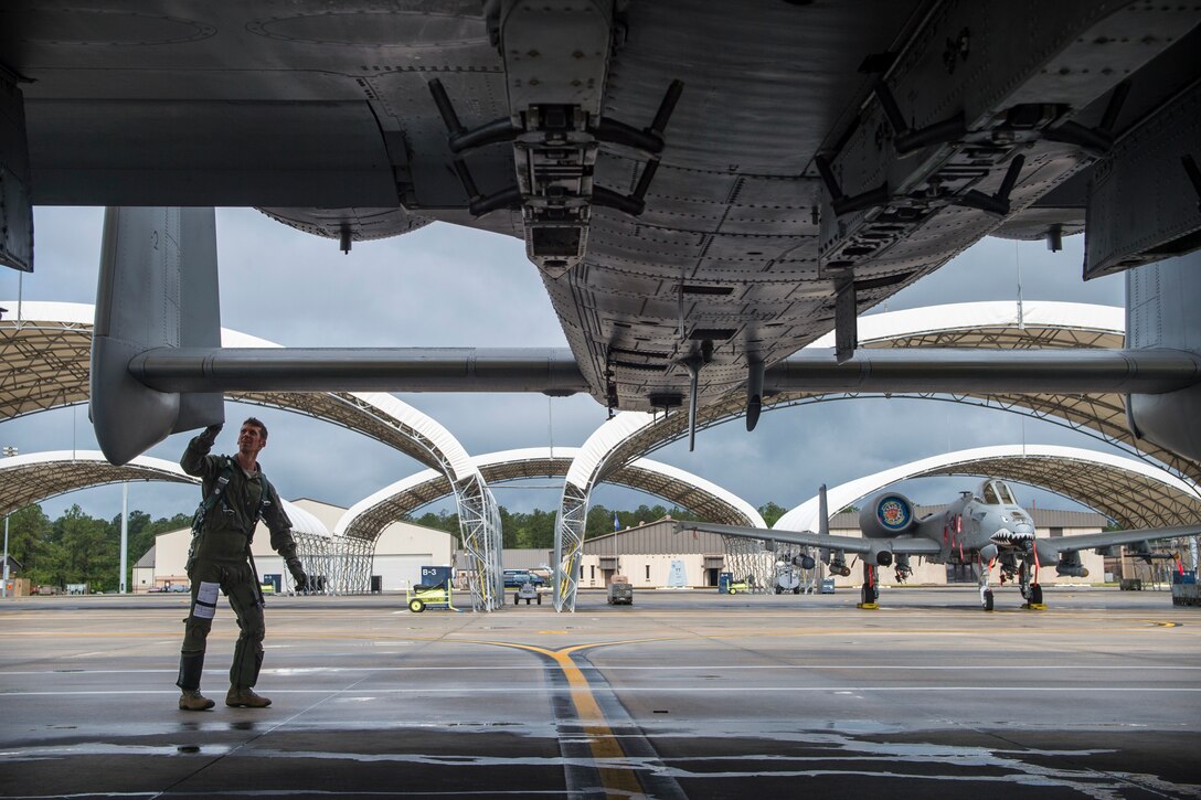 Lt. Col. Jeremy Johnston, 23d Fighter Group A-10C Thunderbolt II pilot, checks the vertical stabilizer prior to flying, May 17, 2018, at Moody Air Force Base, Ga. Airmen conduct routine training missions in the airspace surrounding Moody to remain current on their tactics and procedures. While helping pilots remain proficient, training also gives crew chiefs and maintainers the opportunity to remain proficient at launching and maintaining the aircraft. (U.S. Air Force photo by Senior Airman Janiqua P. Robinson)