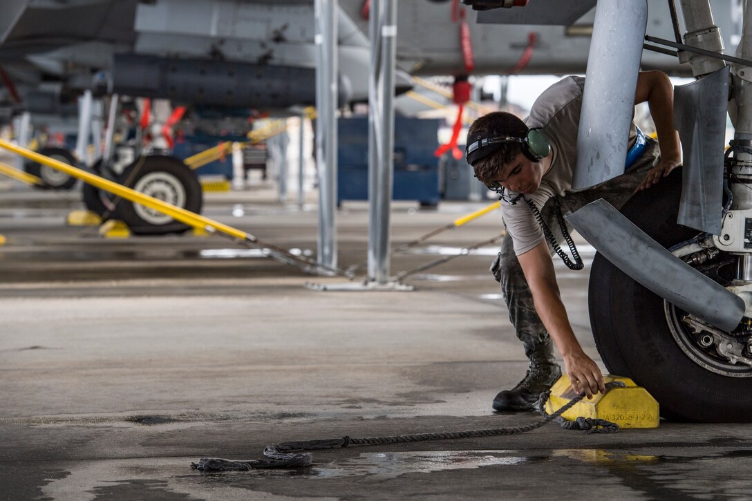 Airman 1st Class Jacob Curry, 23d Aircraft Maintenance Squadron crew chief, removes a chalk prior to launching an A-10C Thunderbolt II, May 17, 2018, at Moody Air Force Base, Ga. Airmen conduct routine training missions in the airspace surrounding Moody to remain current on their tactics and procedures. While helping pilots remain proficient, training also gives crew chiefs and maintainers the opportunity to remain proficient at launching and maintaining the aircraft. (U.S. Air Force photo by Senior Airman Janiqua P. Robinson)
