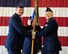 Col. Stan Lawrie, 14th Operations Group commander, passes the guidon of the 48th Flying Training Squadron to Lt. Col. Jason Richardson May 15, 2018 on Columbus Air Force Base, Mississippi. Richardson’s major weapon system, prior to his new position, is the C-17 Globemaster III. (U.S. Air Force photo by Elizabeth Owens)