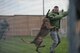 Senior Airman Raymond Dwoznik, 14th Security Forces Squadron military working dog handler, demonstrates the unit’s capabilities May 16, 2018, on Columbus Air Force Base, Mississippi. (U.S. Air Force photo by Airman 1st Class Keith Holcomb)