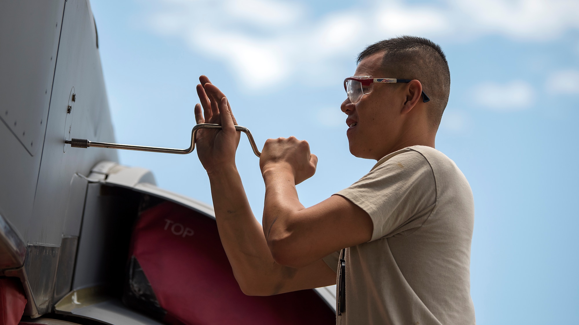 An aircraft maintenance crewmember unscrews a KC-135 Stratotanker aircraft panel during a 900-hour inspection at MacDill Air Force Base, Fla., May 16, 2018. During this inspection, maintenance crewmembers perform major and minor servicing to the aircraft’s structure. MacDill’s contribution to global mobility is possible because of the maintenance Airmen who dedicate countless hours to ensure aircraft are fit for flight.