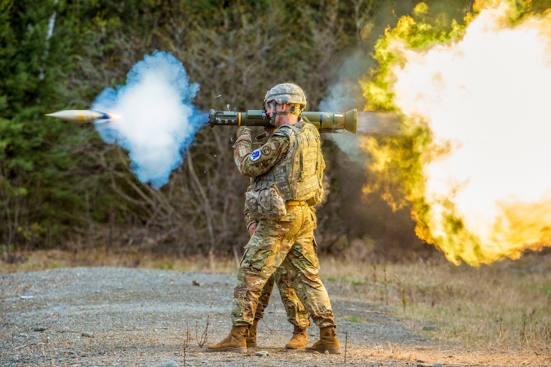 A soldier fires an M136E1 AT4-CS weapon.