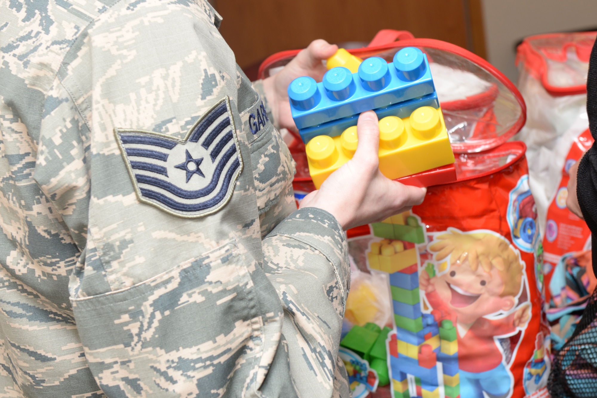 Tech. Sgt. Jennifer Garrison, 28th Medical Operations Squadron noncommissioned officer in charge of the mental health clinic, separates blocks for a team building exercise with the human performance team at Ellsworth Air Force Base, S.D., May 9, 2018. The chapel and mental health clinic went out in human performance teams to connect with Airmen and provide information on the different ways to improve their mental resiliency. (U.S. Air Force photo by Airman 1st Class Nicolas Z. Erwin)