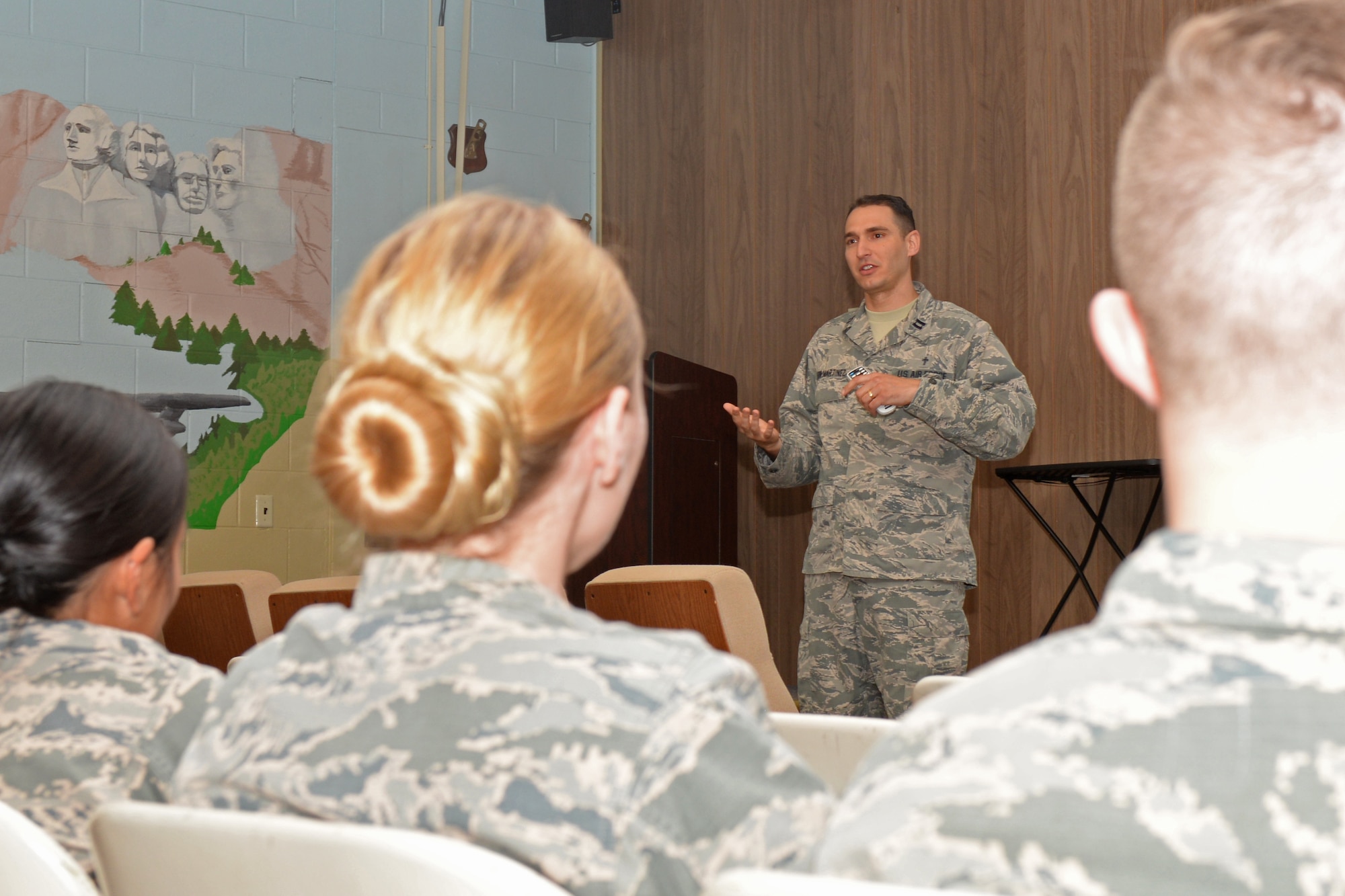 Capt. Raidel Leon-Martinez, a 28th Bomb Wing chaplain, talks to Airmen at the 28th Communications Squadron building about having boundaries and taking care of themselves at Ellsworth Air Force Base, S.D., May 9, 2018. The wing’s chapel team paired up with the mental health clinic to help Airmen express anything going on in their lives and to know the avenues they have access to. (U.S. Air Force photo by Airman 1st Class Nicolas Z. Erwin)