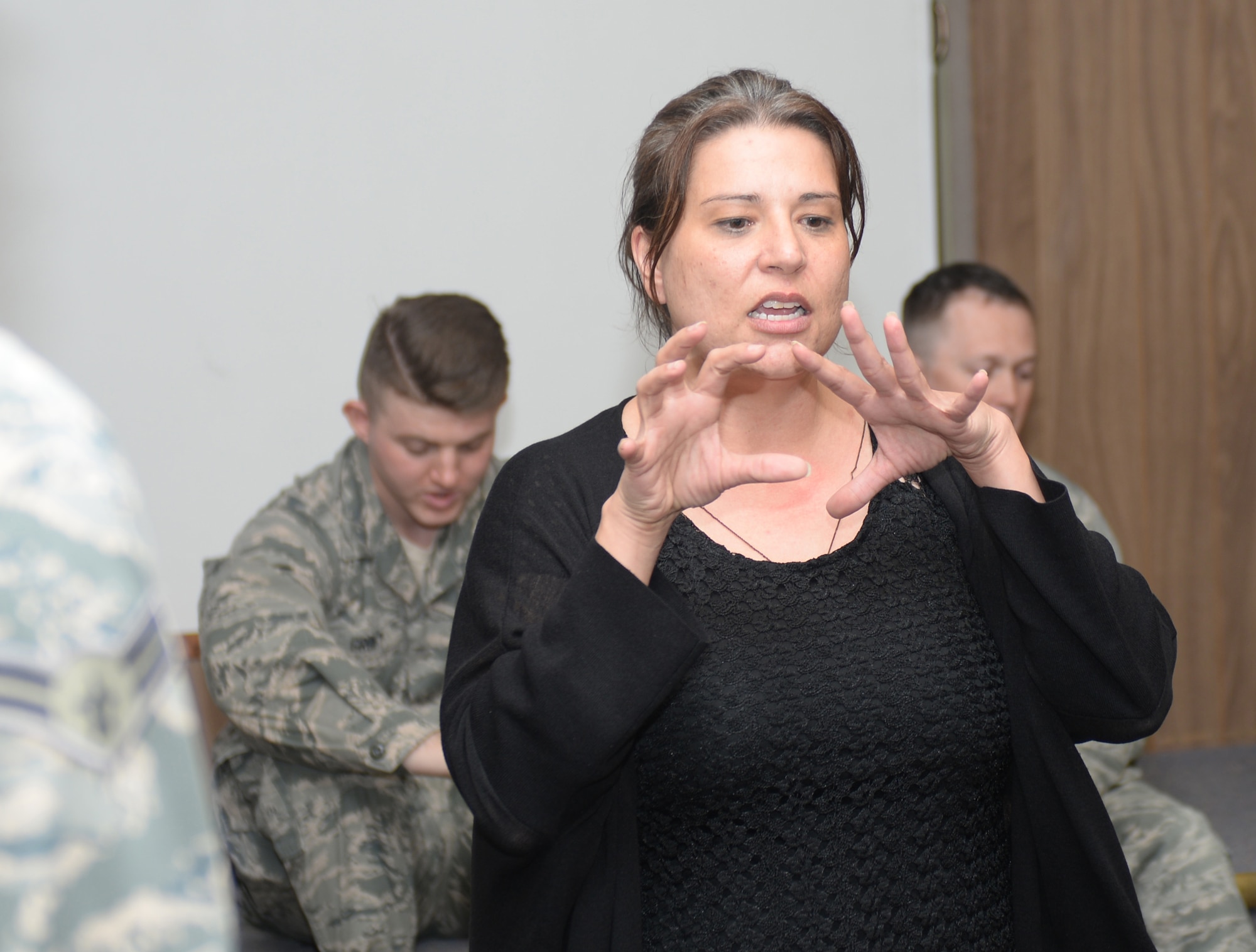 Christle Usera, a 28th Medical Operations Squadron mental health provider, explains the rules of a human performance team building exercise at Ellsworth Air Force Base, S.D., May 9, 2018. These team building exercises help teach Airmen the value of communication when going through situations out of their control. (U.S. Air Force photo by Airman 1st Class Nicolas Z. Erwin)