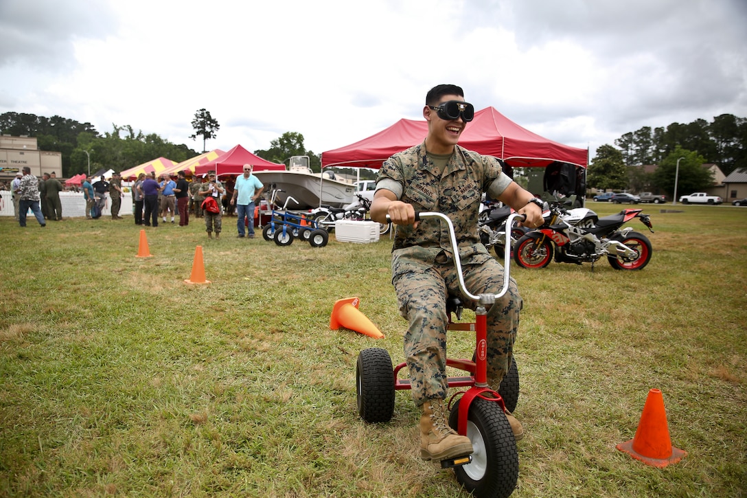 A Marine participates in a simulated drunk driving course at a booth during the Marine Corps Air Station Beaufort aboard MCAS Beaufort May 14. Participants wore goggles
that affected the driver’s eyesight as they went through the course to simulate the effects of drunk driving. The event was held to bring awareness to how Marines can be
safe during the “101 Days of Summer”.