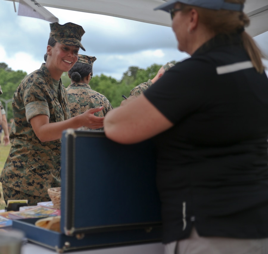 Gunnery Sgt. Sonya Bryant gets information from a nutrition booth at the Marine Corps Air Station Beaufort safety fair aboard MCAS Beaufort May 14. A variety of booths
from several organizations from the air station and the local community participated in the event to educate MCAS Beaufort personnel on the importance of safety on and
off duty. teach about safety and leading healthy lives. Bryant is an administrative chief with the air station.