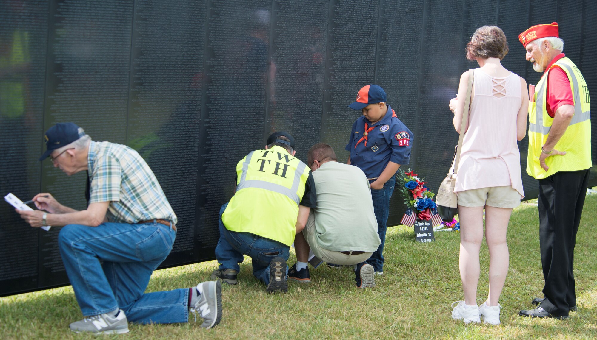 Visitors at The Wall That Heals look for names on the memorial in Camden, S.C., May 5, 2018.