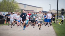 Team Minot families participated in a color run at Minot Air Force Base, N.D., May 17, 2018.  The 5th Medical Group’s Health and Wellness Center teamed up with the base’s master resiliency trainer to host the resiliency-themed event.  More than 100 individuals ran the course that consisted of six color stations spanning the two, five and 10 km routes. (U.S. Air Force photo by Senior Airman J.T. Armstrong)