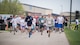 Team Minot families participated in a color run at Minot Air Force Base, N.D., May 17, 2018.  The 5th Medical Group’s Health and Wellness Center teamed up with the base’s master resiliency trainer to host the resiliency-themed event.  More than 100 individuals ran the course that consisted of six color stations spanning the two, five and 10 km routes. (U.S. Air Force photo by Senior Airman J.T. Armstrong)
