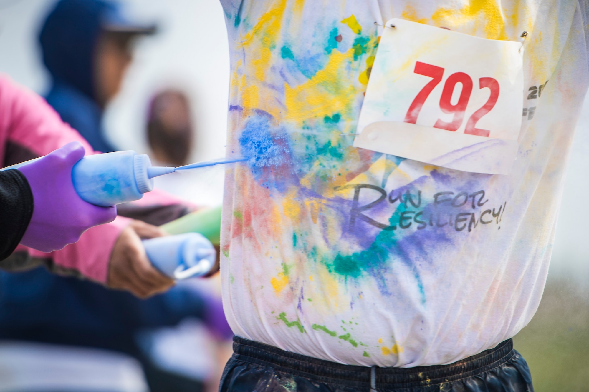 Team Minot families participated in a color run at Minot Air Force Base, N.D., May 17, 2018.  The 5th Medical Group’s Health and Wellness Center teamed up with the base’s master resiliency trainer to host the resiliency-themed event.  More than 100 individuals ran the course that consisted of six color stations spanning the two, five and 10 km routes. (U.S. Air Force photo by Senior Airman J.T. Armstrong)