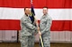 Col. André A. McMillian, 94th Maintenance Group commander, passes the 94th MXG guidon to Maj. Wade Smith during an assumption-of-command ceremony at Dobbins Air Reserve Base, Ga. on May 5, 2018. Smith formally assumed command of the 94th Aircraft Maintenance Squadron during the event. (U.S. Air Force photo/Senior Airman Josh Kincaid)