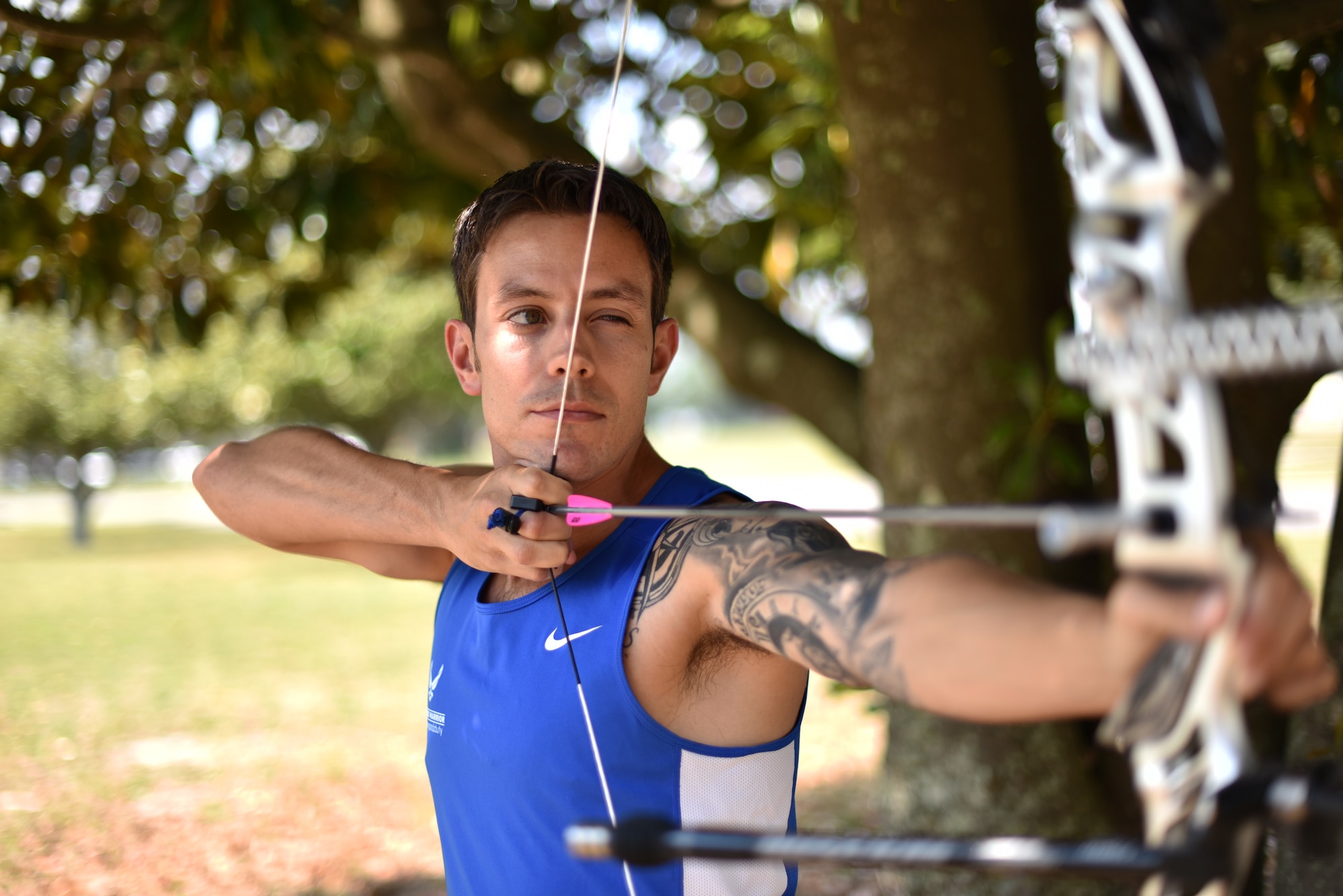 U.S. Air Force Wounded Warrior Master Sgt. Kenneth Guinn, 325th Civil Engineering Squadron Explosive Ordnance Disposal Logistics section chief, readies an arrow on a recurve bow at Tyndall Air Force Base, Fla., May 15, 2018. Guinn was selected to participate in the 2018 Warrior Games for track, field, archery, power-lifting, sitting volley ball and wheelchair basketball. (U.S. Air Force photo by Airman 1st Class Delaney Gonzales/Released)