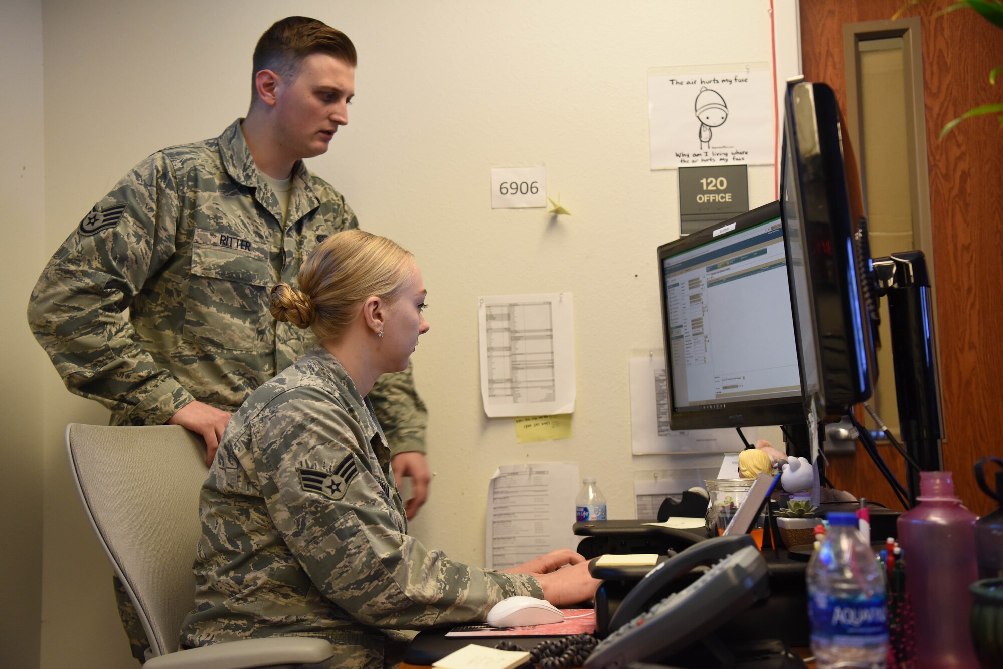 Senior Airman Skyler Vinay, a 28th Communications Squadron cyber transport systems technician and Staff Sgt. Sebastian Ritter, 28th CS Communications Focal Point noncommissioned officer in charge, inspect a computer during the Cyber Storm exercise at Ellsworth Air Force Base, S.D., May 14, 2018. Cyber Storm is in its second year and is used to help the 28th CS find cybersecurity weaknesses and be more effective in a cyber-contested environment. (U.S. Air Force photo by Airman 1st Class Thomas Karol)