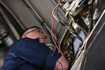 Tech. Sgt. Timothy Kenny, a 28th Aircraft Maintenance Squadron aircraft electrical environmental craftsman, inspects an aircraft part with the help of a technical order during Combat Raider 18-2 at Ellsworth Air Force Base, S.D., May 14, 2018. Combat Raider is a joint exercise that involves multiple airframes from different bases to prepare Airmen and the Air Force for potential future conflicts. (U.S. Air Force photo by Airman 1st Class Thomas Karol)