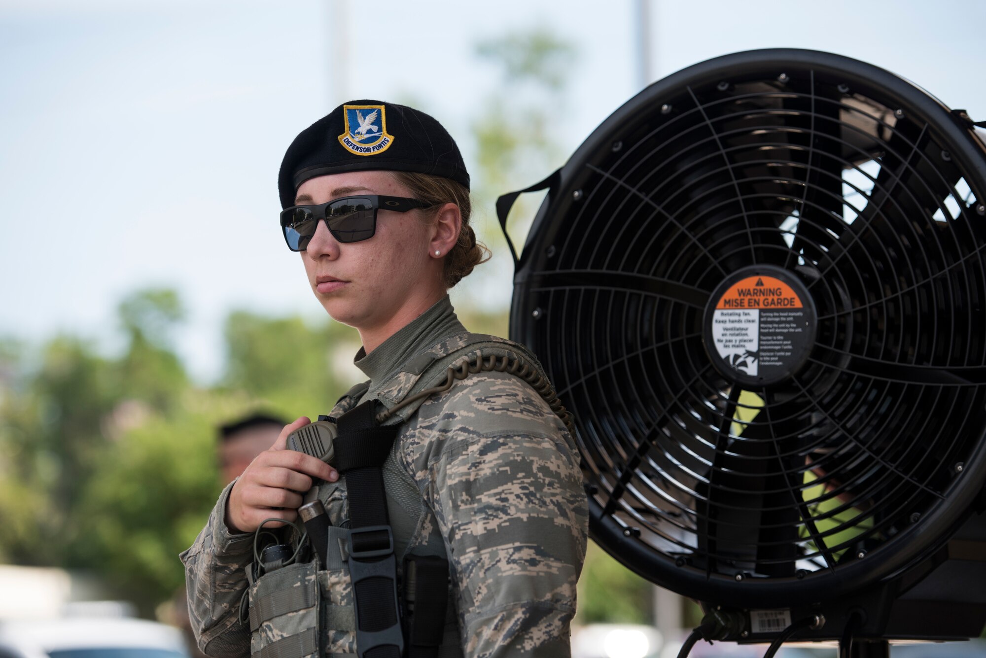 Airman 1st Class Leah Schuldt, 81st Security Forces Squadron entry controller, radios in an exercise situation at a gate during a ride-along at Keesler Air Force Base, Miss. May 17, 2018. The ride-along program is part of the SFS community involvement initiative where anyone, age 15 and up and with base access, can see what its like to be a defender. If you are interested in the ride-along program, please contact Tech. Sgt. Matthew Oleson at 376-6601. (U.S. Air Force photo by Senior Airman Travis Beihl)