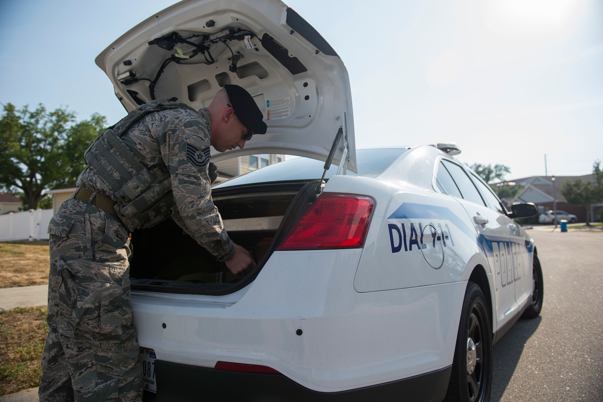 Tech. Sgt. Jarrod Kinard, 81st Security Forces Squadron flight chief, retrieves his firearm from the trunk of his patrol car during a ride-along at Keesler Air Force Base, Miss., May 17, 2018. The ride-along program is part of the 81st SFS community involvement initiative where anyone, age 15 and up and with base access, can see what it's like to be a defender. If you are interested in the ride-along program, please contact Tech. Sgt. Matthew Oleson at 228-376-6601. (U.S. Air Force photo by Senior Airman Travis Beihl)