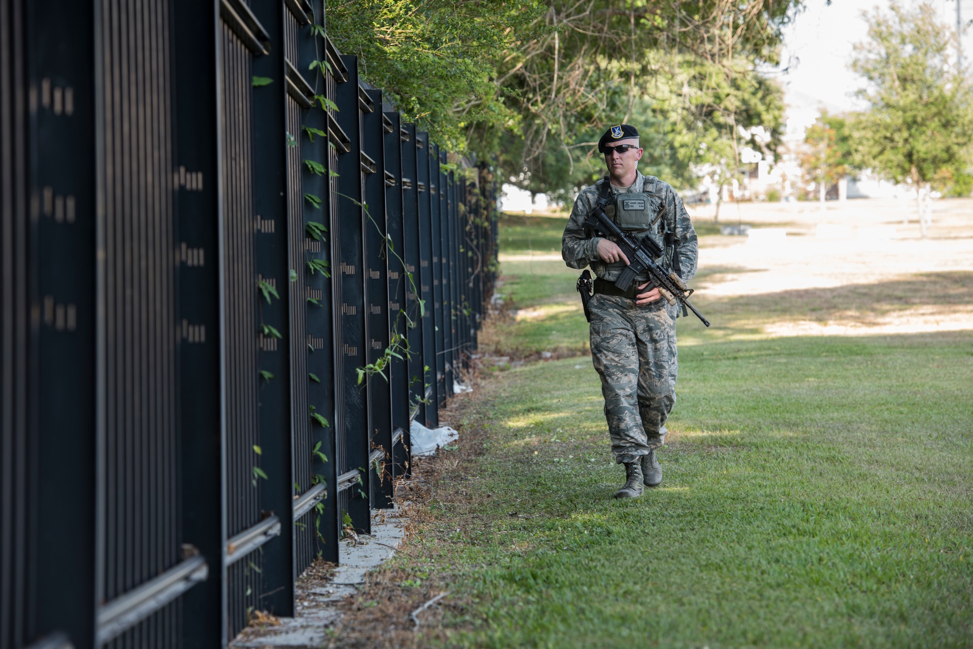 Tech. Sgt. Jarrod Kinard, 81st Security Forces Squadron flight chief, patrols the perimeter of the gate during a ride-along at Keesler Air Force Base, Miss., May 17, 2018. The ride-along program is part of the 81st SFS community involvement initiative where anyone, age 15 and up and with base access, can see what it's like to be a defender. If you are interested in the ride-along program, please contact Tech. Sgt. Matthew Oleson at 228-376-6601. (U.S. Air Force photo by Senior Airman Travis Beihl)