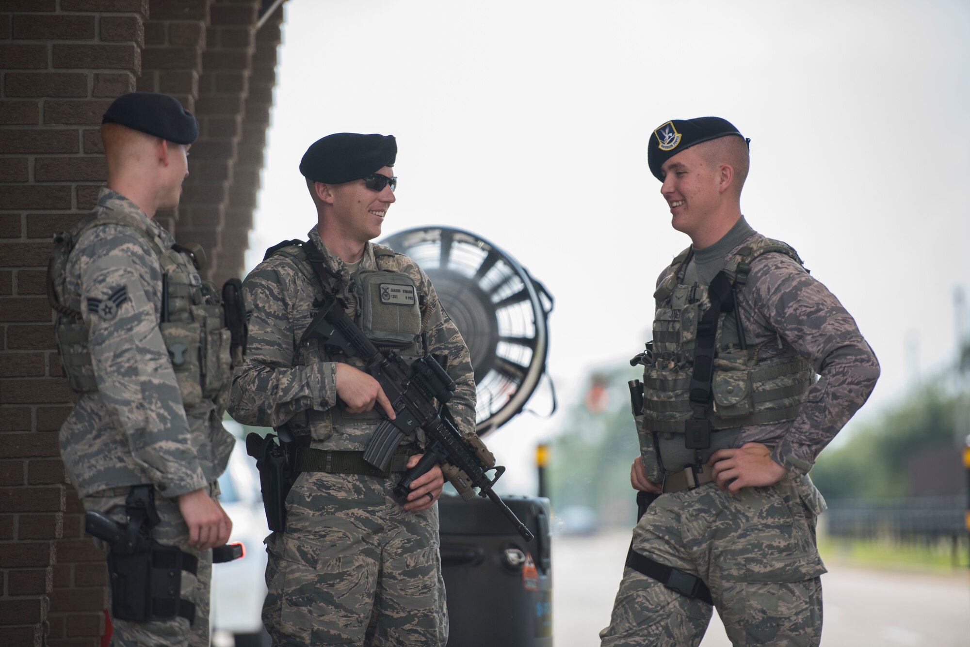 Tech. Sgt. Jarrod Kinard, 81st Security Forces Squadron flight chief, center, talks with Senior Airman Trevor Perley and Airman Joseph Maerkl, 81st SFS airmen, during a routine check up during a ride-along at Keesler Air Force Base, Miss., May 17, 2018. The ride-along program is part of the 81st SFS community involvement initiative where anyone, age 15 and up and with base access, can see what it's like to be a defender. If you are interested in the ride-along program, please contact Tech. Sgt. Matthew Oleson at 228-376-6601. (U.S. Air Force photo by Senior Airman Travis Beihl)