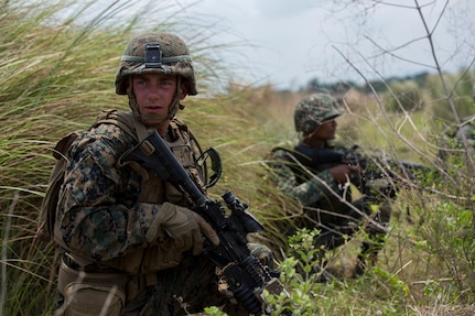 U.S. Marine Corps Lance Cpl. Nic Arendale, a grenadier assigned to 2nd Battalion, 8th Marine Regiment and Philippine Marines with 10th Marines Company provide security on the beach during the amphibious landing exercise as part of Exercise Balikatan at the Naval Education and Training Center, in San Antonio, Zambales, Philippines May 8, 2018. This training is held to further interoperability between the U.S. and the Philippines while conducting amphibious exercises. Exercise Balikatan, in its 34th iteration, is an annual U.S.-Philippine military training exercise focused on a variety of missions, including humanitarian assistance and disaster relief, counterterrorism and other combined military operations held from May 7 to 18. (U.S. Marine Corps photo by Pfc. Krysten I. Gomez)