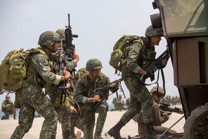 U.S. Marines assigned to 2nd Battalion, 8th Marine Regiment and Philippine Marines with 10th Marines Company ride in an assault amphibious vehicle during an amphibious landing exercise at the Navy Education and Training Command in San Antonio, Zambales, May 9, 2018 during Exercise Balikatan. This training is held to further interoperability between the U.S. and the Philippines while conducting amphibious exercises. Exercise Balikatan, in its 34th iteration, is an annual U.S.-Philippine military training exercise focused on a variety of missions, including humanitarian assistance and disaster relief, counterterrorism and other combined military operations held from May 7 to 18. (U.S. Marine Corps photo by Cpl. Charles Plouffe)