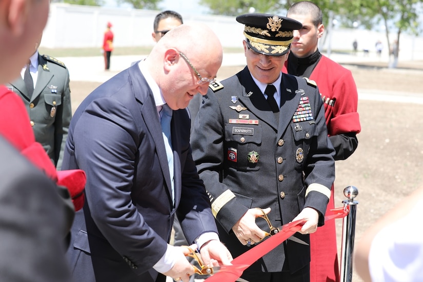 Georgian defense minister and U.S. general cut ribbon for new training facility.