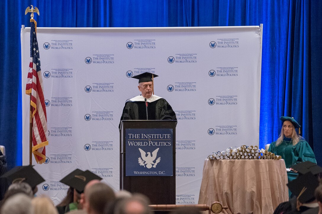 Defense Secretary James N. Mattis stands at a podium during a commencement ceremony.