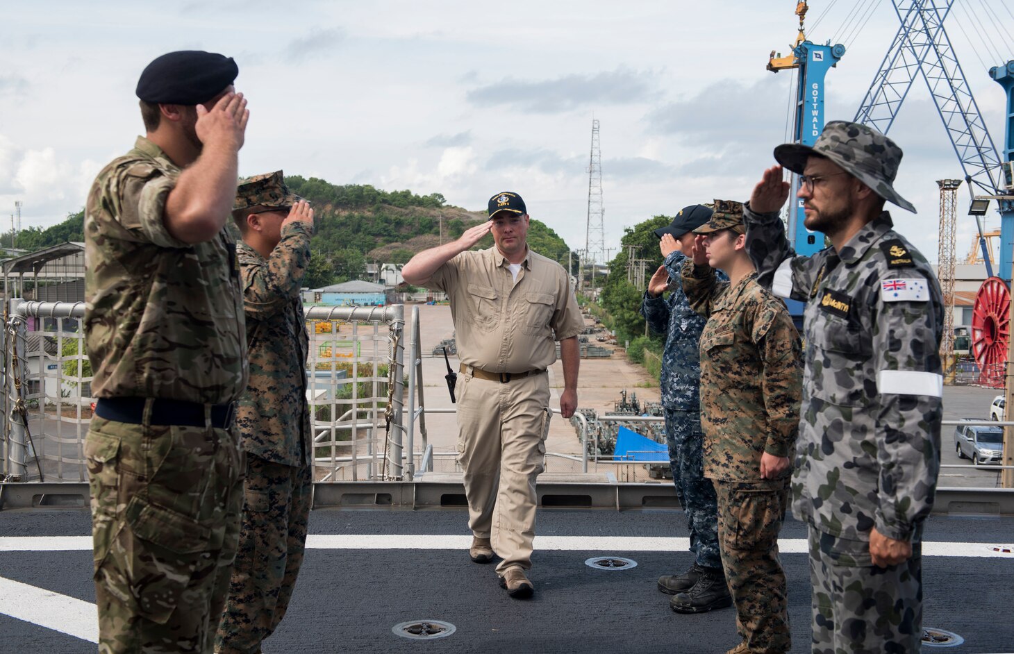Capt. Charles Black, commanding officer of USNS Brunswick, salutes sideboys upon arrival to the opening ceremony of Pacific Partnership 2018 (PP18) Thailand aboard Military Sealift Command expeditionary fast transport ship USNS Brunswick (T-EPF 6). PP18’s mission is to work collectively with host and partner nations to enhance regional interoperability and disaster response capabilities, increase stability and security in the region, and foster new and enduring friendships across the Indo-Pacific Region. Pacific Partnership, now in its 13th iteration, is the largest annual multinational humanitarian assistance and disaster relief preparedness mission conducted in the Indo-Pacific.