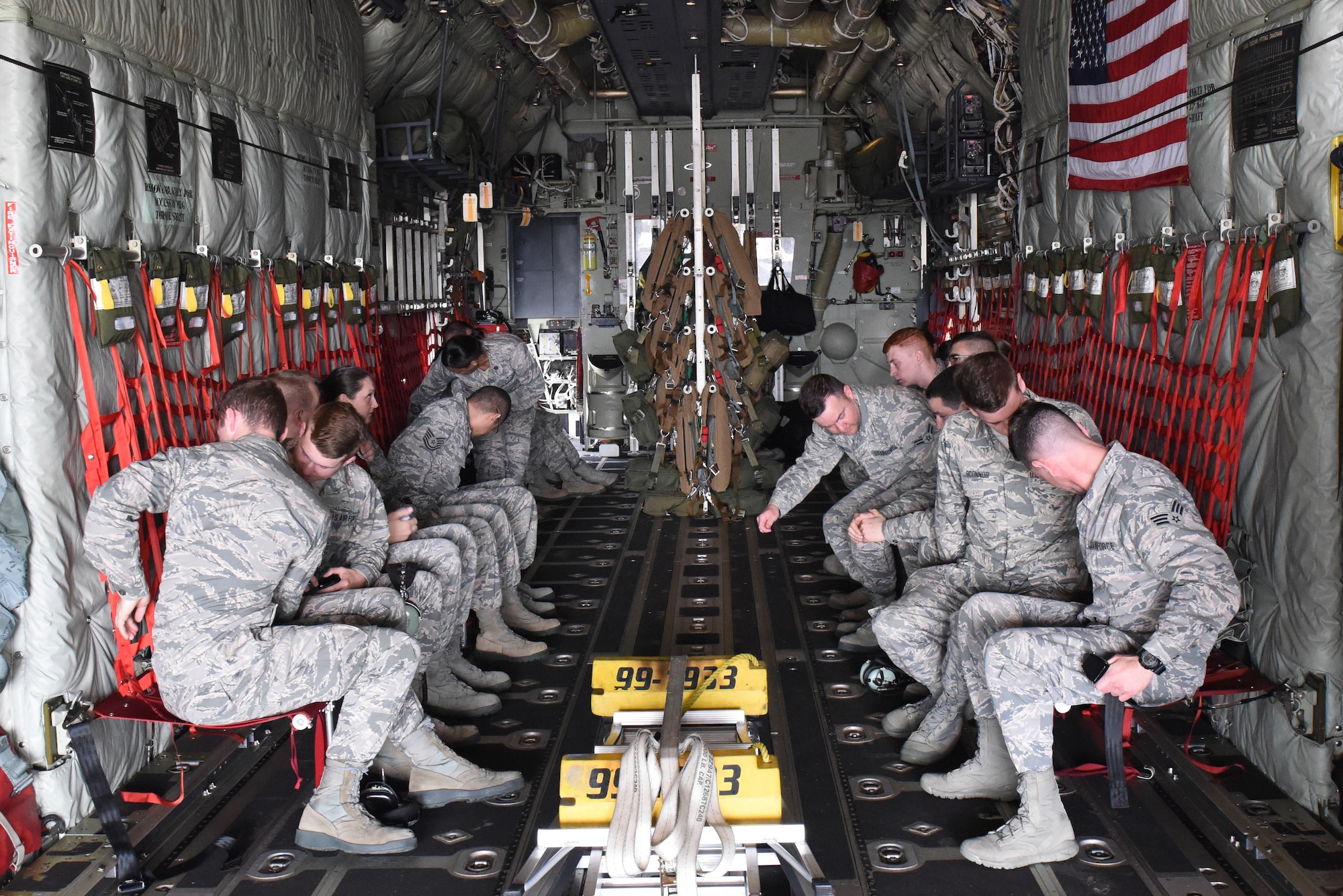 Airmen from the 193rd Special Operations Wing, Middletown, Pennsylvania, situate themselves within an EC-130 aircraft prior to the departure of an incentive flight May 20, 2018. Eighteen Airmen were nominated for the incentive flight. (U.S. Air National Guard photo by Senior Airman Julia Sorber/Released)