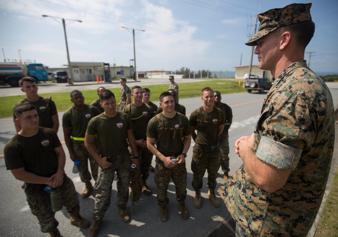 Sgt. Brent Hawkins addresses Marines May 18, 2018 on Camp Schwab, Okinawa, Japan. Hawkins recently won the outstanding squad leader award while participating in the 3rd annual Marine Corps Combat Engineer Sapper Challenge. Hawkins, a native of Decatur, Illinois, is a squad leader with Combat Engineer Company, Combat Assault Battalion, 3rd Marine Division. (U.S. Marine Corps photo by Lance Cpl. Cameron Parks)