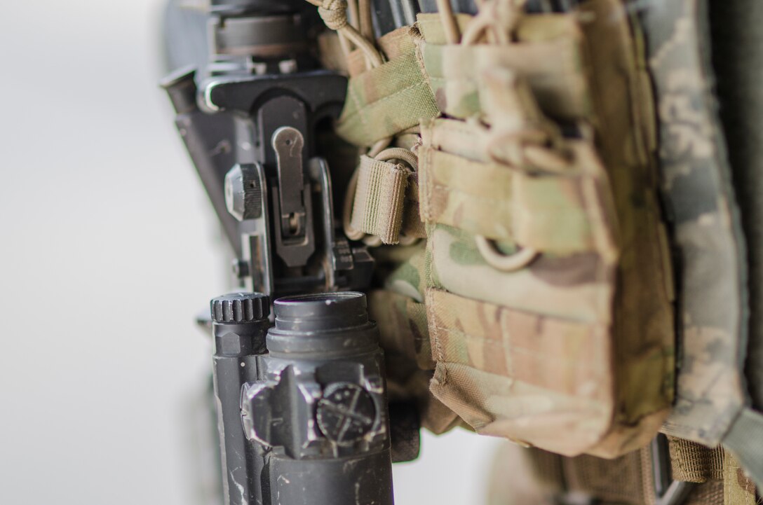 Filled equipment pouches hang off Senior Airman Gary-Alan Cropley-Tucker, 380th Security Forces, Al Dhafra Base, United Arab Emirates, May 17, 2018. The equipment is part of a security forces Airmen’s “kit” consisting of their body armor and other tools of the peace officers trade. (U.S. Air National Guard photo by Staff Sgt. Ross Alexander Whitley)