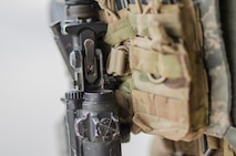 Filled equipment pouches hang off Senior Airman Gary-Alan Cropley-Tucker, 380th Security Forces, Al Dhafra Base, United Arab Emirates, May 17, 2018. The equipment is part of a security forces Airmen’s “kit” consisting of their body armor and other tools of the peace officers trade. (U.S. Air National Guard photo by Staff Sgt. Ross Alexander Whitley)