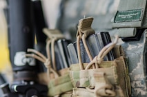 Filled equipment pouches hang off Senior Airman Gary-Alan Cropley-Tucker, 380th Security Forces, Al Dhafra Base, United Arab Emirates, May 17, 2018. The equipment is part of a security forces Airmen’s “kit” consisting of their body armor and other tools of the peace officers trade. (U.S. Air National Guard photo by Staff Sgt. Ross Alexander Whitley)