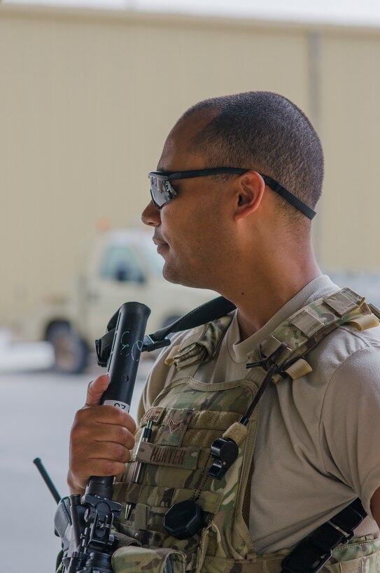 Senior Airman Alexander Hunter, 380th Security Forces, works a gate at Al Dhafra Air Base, United Arab Emirates, May 17, 2018. Air force security forces members are trained in law enforcement and combat arms to protect and serve their fellow Airmen. (U.S. Air National Guard photo by Staff Sgt. Ross Alexander Whitley)
