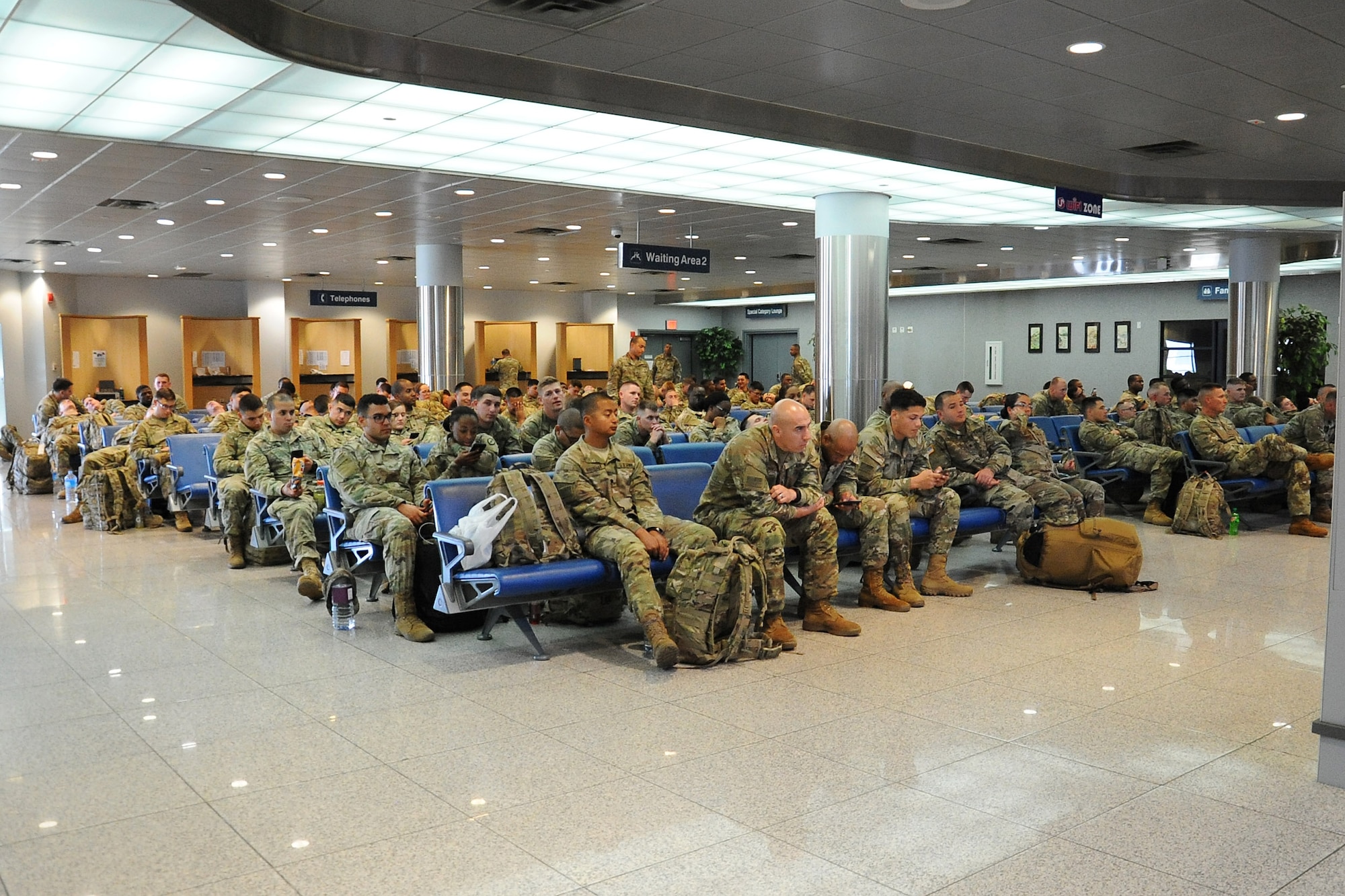 U.S. Soldiers assigned to various units under the 25th Infantry Division wait to board a Korean Air Boeing 777 aircraft at Osan Air Base, Republic of Korea May 4, 2018. The Soldiers boarded the plane as part of the Mutual Airlift Support Agreement exercise for the first time at Osan Air Base to test interoperability and procedures between the United States military, ROK Air Force and Korean Air Lines. (U.S. Air Force photo by Tech. Sgt. Ashley Tyler)