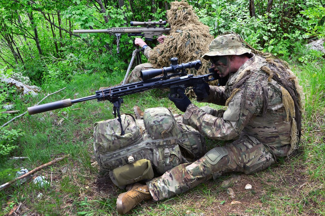 Soldiers engage targets during sniper training.