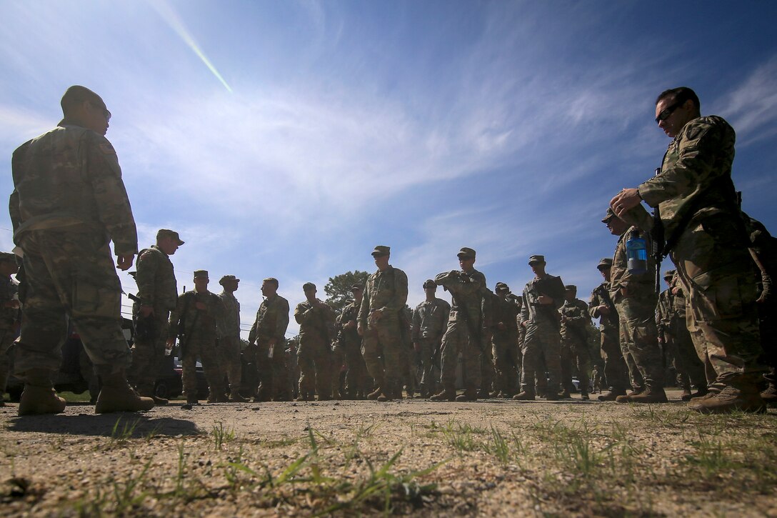 Soldiers receive a safety briefing before conducting a live-fire range.