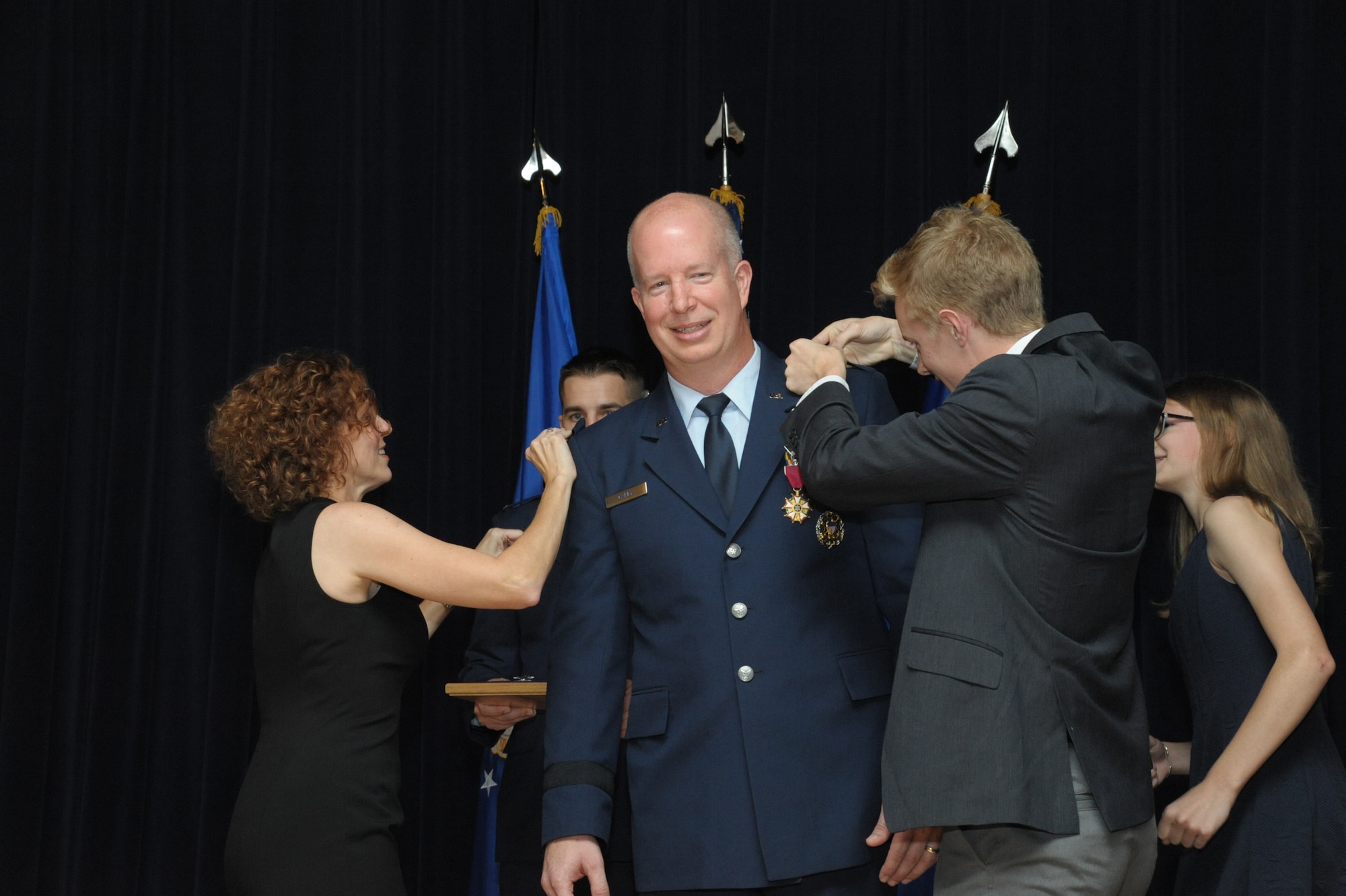 Air Force Col. Joel Carey, 12th Flying Training Wing commander, is promoted to the rank of brigadier general, May 18, 2018, Joint Base San Antonio-Randolph, Texas. The 12FTW is responsible for four single-source aviation pipelines – Pilot Instructor Training, Combat Systems Officer Training, Remotely Piloted Aircraft Pilot Indoctrination, and Basic Sensor Operator Qualification. (U.S. Air Force photo by Joel Martinez)