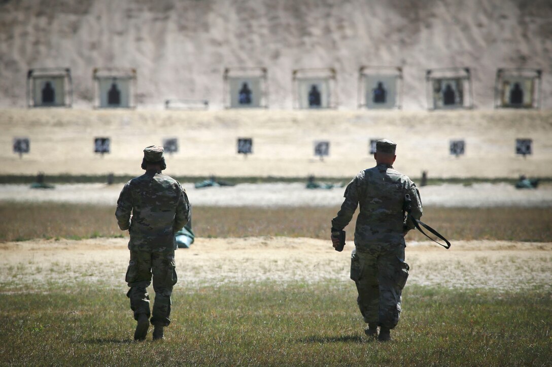Soldiers walk toward the 100-meter firing positions.