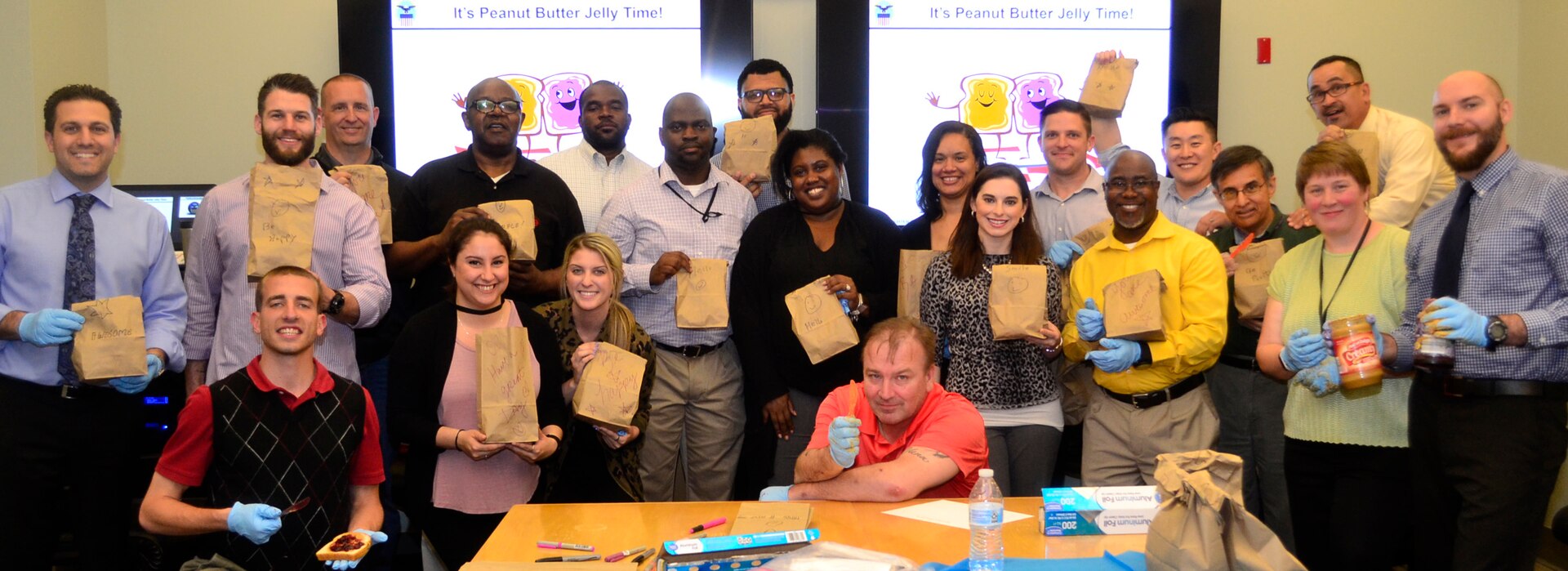 Mentors and mentees join together to make sandwiches as part of "blessing bags" for the homeless in Philadelphia on May 17.