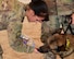 Staff Sgt. Kathryn McCarthy, 386th Expeditionary Security Forces Squadron military working dog trainer, gives MWD Herceg a drink of water at an undisclosed location in Southwest Asia, May 18, 2018. Excluding physical threats, dehydration poses as one of the greatest dangers to personnel supporting Operation Inherent Resolve. (U.S. Air Force photo by Senior Airman Michala Weller)