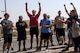 The winning team of the police week relay race celebrates as they hear that they won at an undisclosed location in Southwest Asia, May 18, 2018. Police weeks consisted of 12 events over seven days. (U.S. Air Force photo by Staff Sgt. Joshua King)
