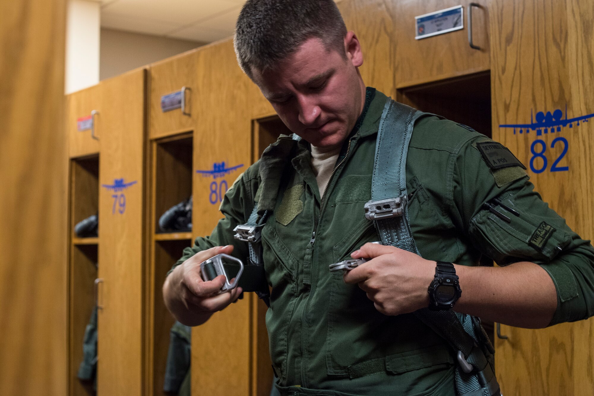 Capt. Aaron Seyfried, 74th Fighter Squadron A-10C Thunderbolt II pilot, dons his gear prior to flying May 17, 2018, at Moody Air Force Base, Ga. Airmen conduct routine training missions in the airspace surrounding Moody to remain current on their tactics and procedures. While helping pilots remain proficient, training also gives crew chiefs and maintainers the opportunity to remain proficient at launching and maintaining the aircraft. (U.S. Air Force photo by Senior Airman Janiqua P. Robinson)