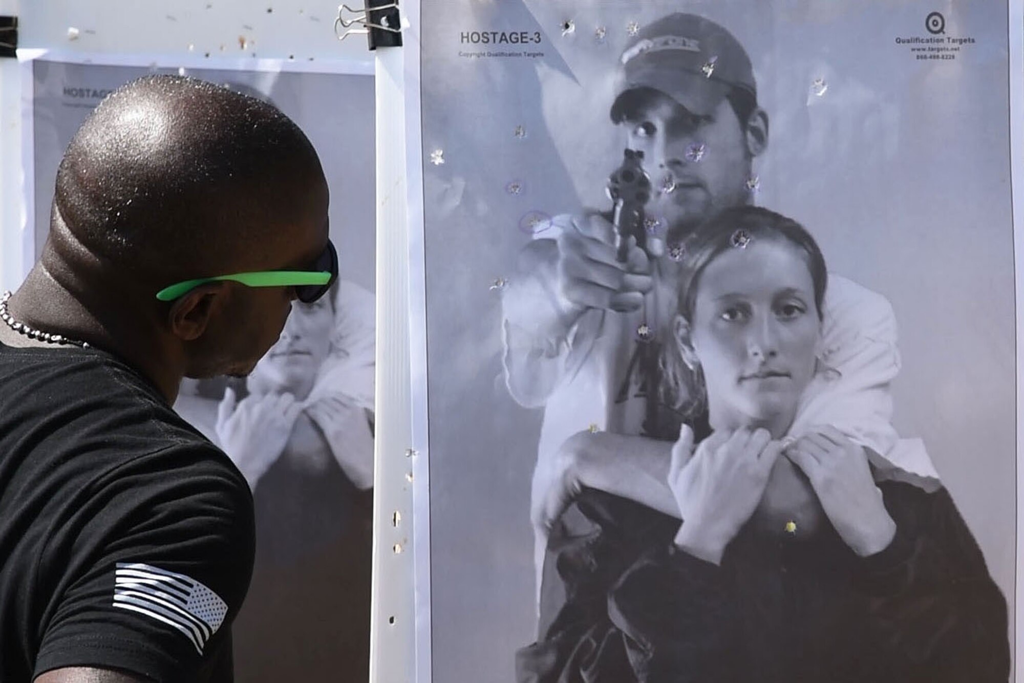 Man looks at target he shot.