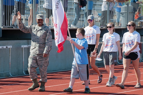 Arnold Air Force Base Staff Sgt. Richard Griffin marches in the procession with the teams at the Area 13 Special Olympics on May 1 at the Tullahoma High School stadium. (U.S. Air Force photos/Jacqueline Cowan)