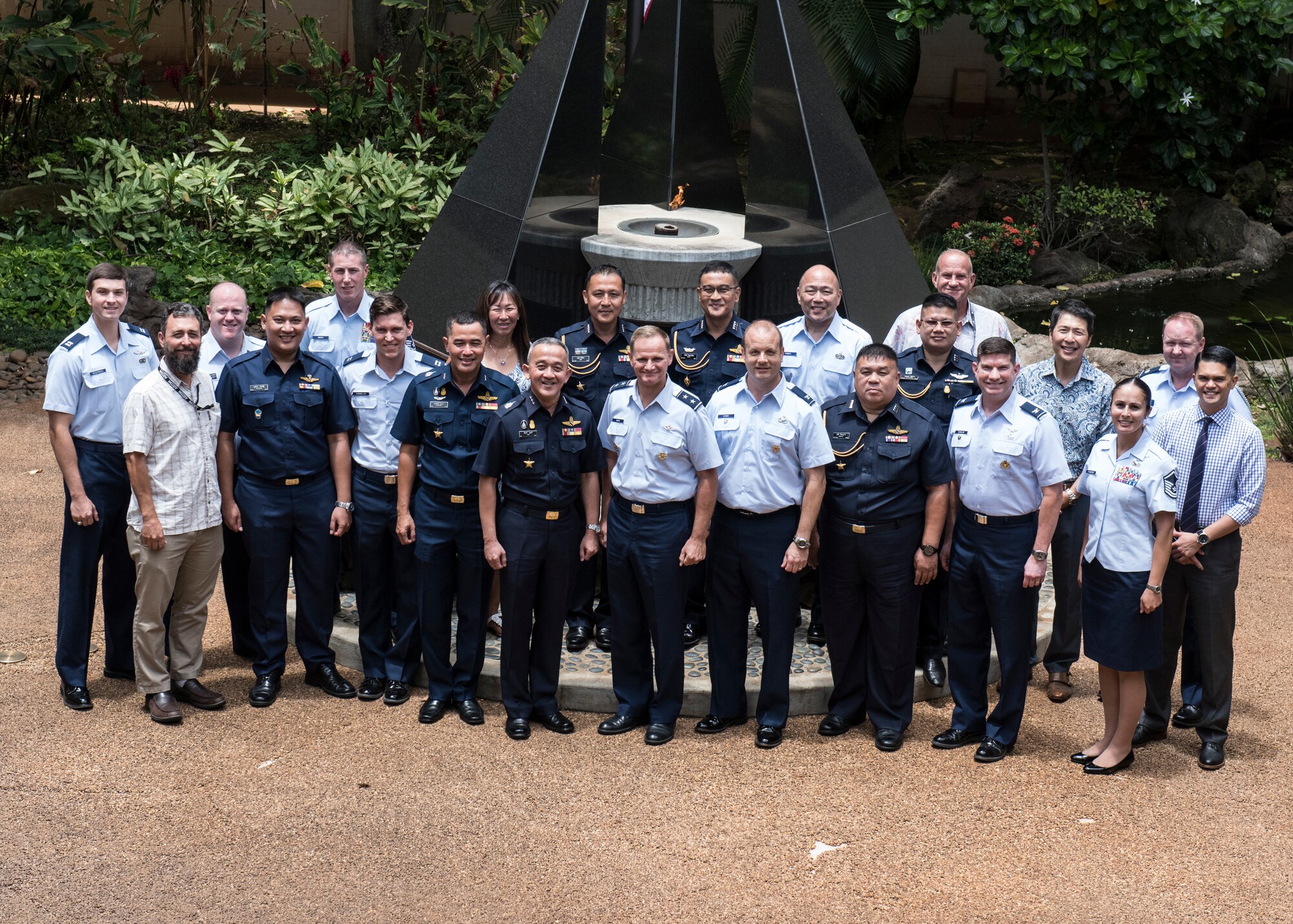 U.S. Air Force Maj. Gen. Russell L. Mack, Pacific Air Forces (PACAF) deputy commander (center right), Royal Thai Air Force Air Marshal Tarin Punsri (center left), and attendees pose for a photo in the Courtyard of Heroes at Joint Base Pearl Harbor-Hickam, Hawaii, May 15, 2018.