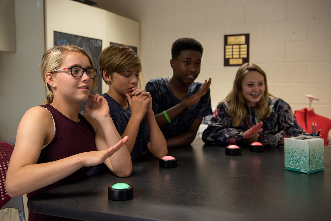 Teenagers from the Youth Center hit buzzers during a quiz game, May 18, 2018, at Seymour Johnson Air Force Base, North Carolina.