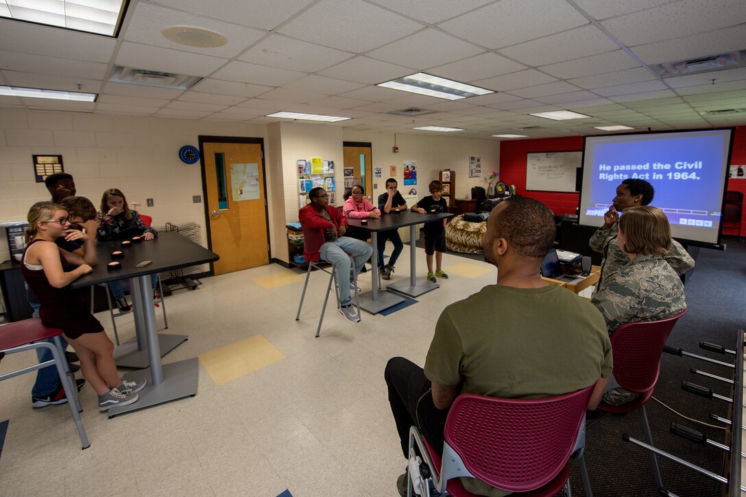 Airmen from the 4th Fighter Wing staff judge advocate office lead teenagers from the Youth Center in a quiz game, May 18, 2018, at Seymour Johnson Air Force Base, North Carolina.