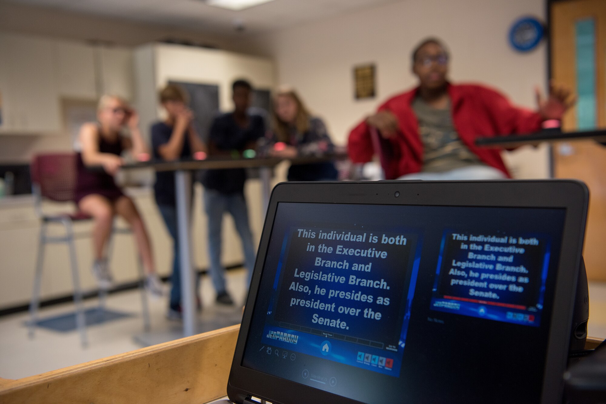 Teenagers from the Youth Center prepare to answer a government-themed question during a quiz game, May 18, 2018, at Seymour Johnson Air Force Base, North Carolina.