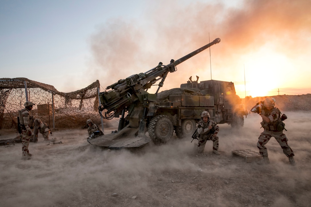 French soldiers fire a mortar during operations in Iraq.